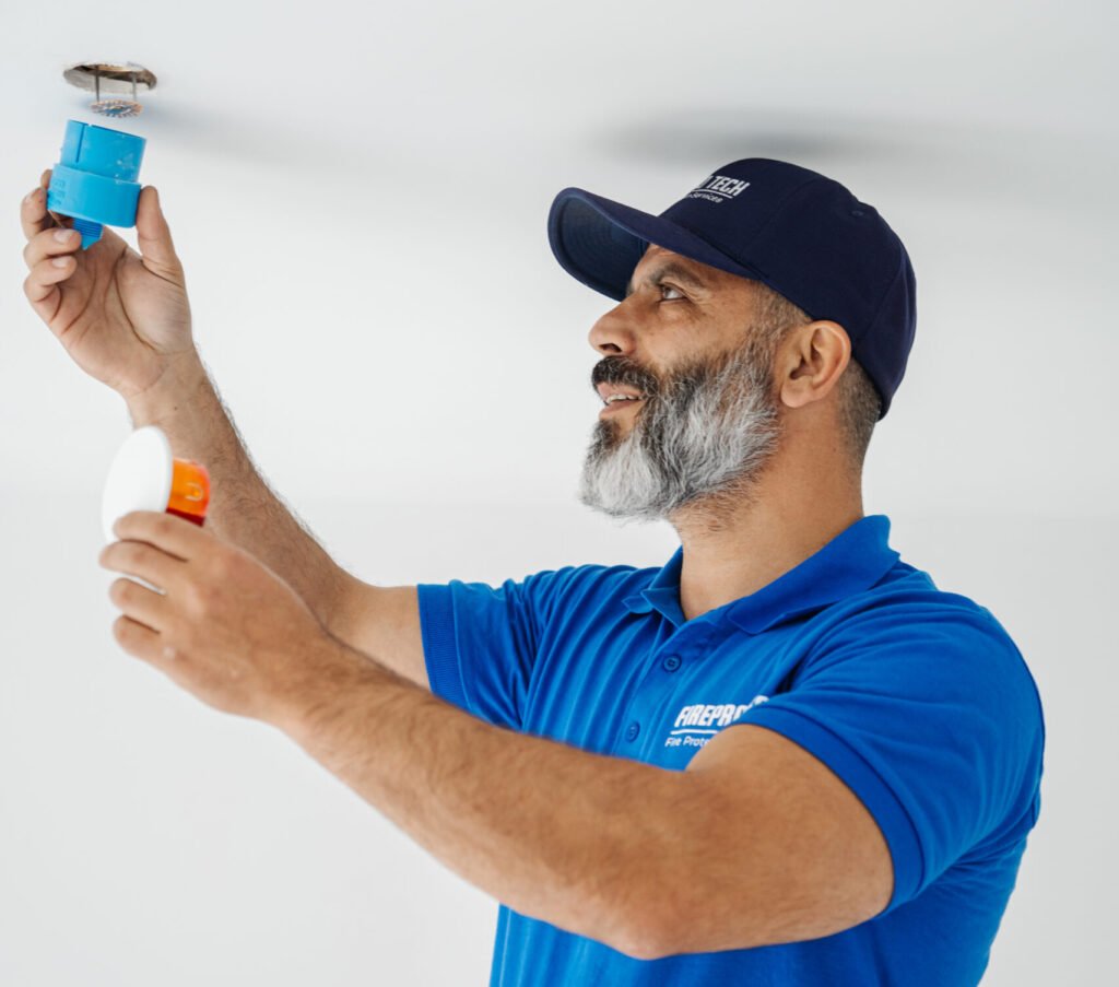 Technician turns off a sprinkler system