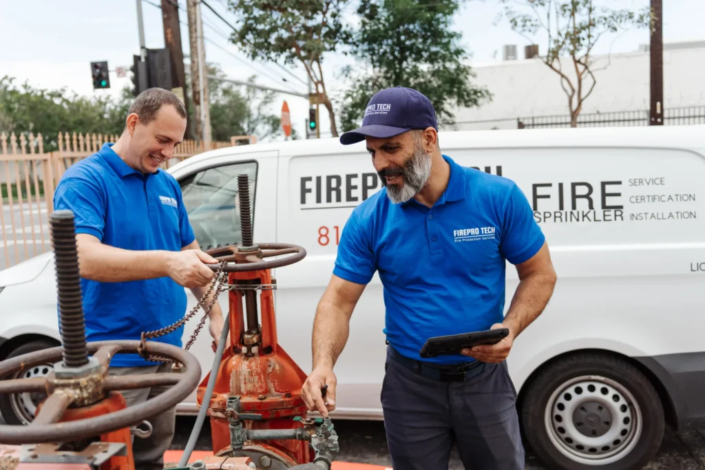 professional inspects draining sprinkler system