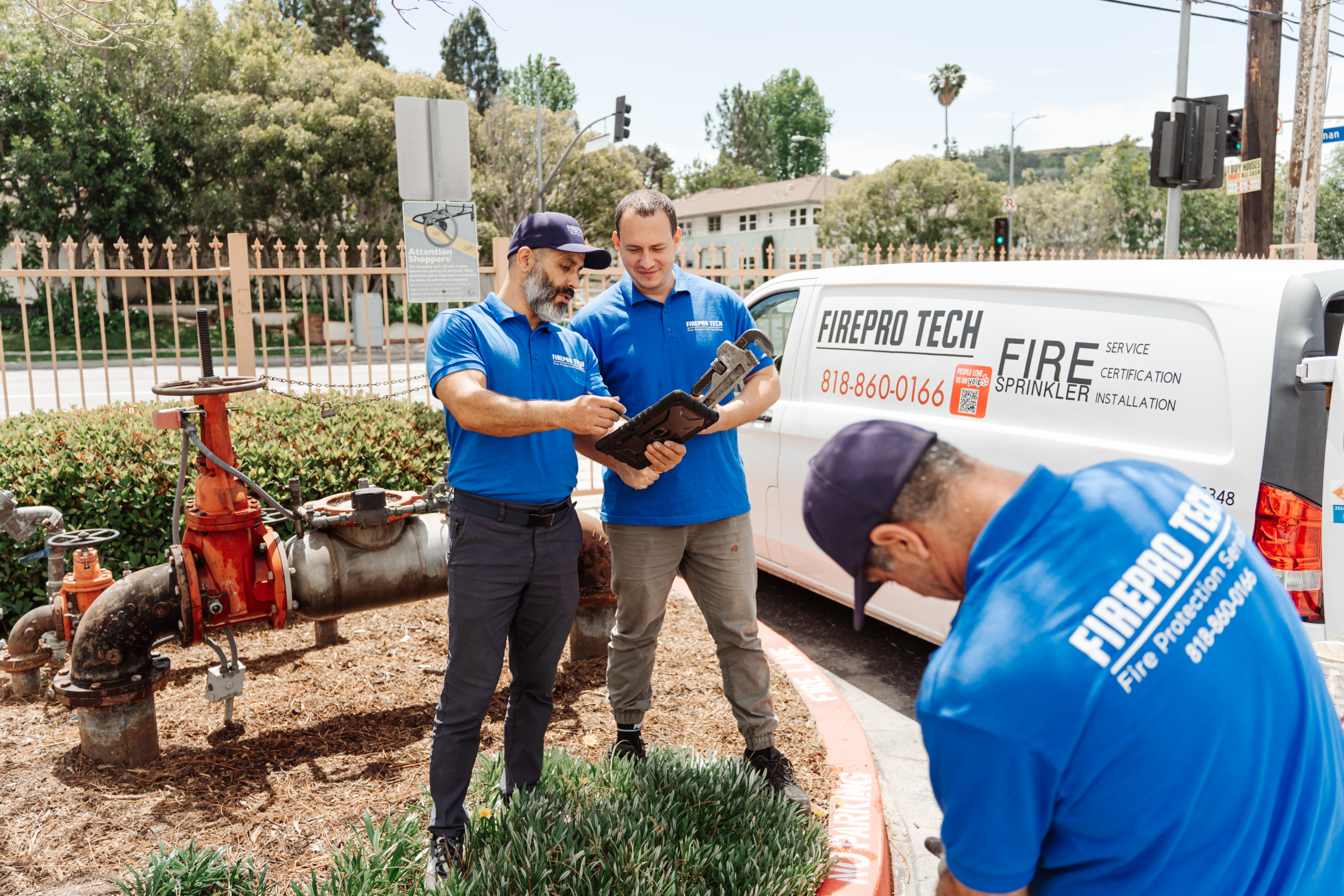 technicians discuss Fire Sprinkler Inspection Requirements