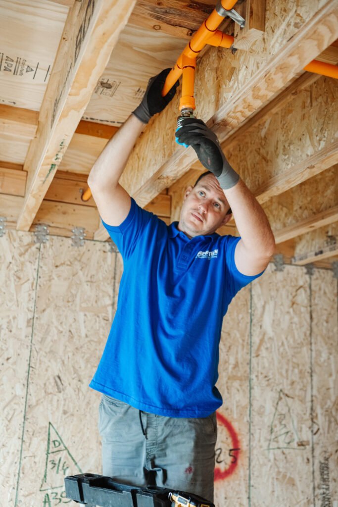 A technicians finishes to deal with fire sprinkler corrosion