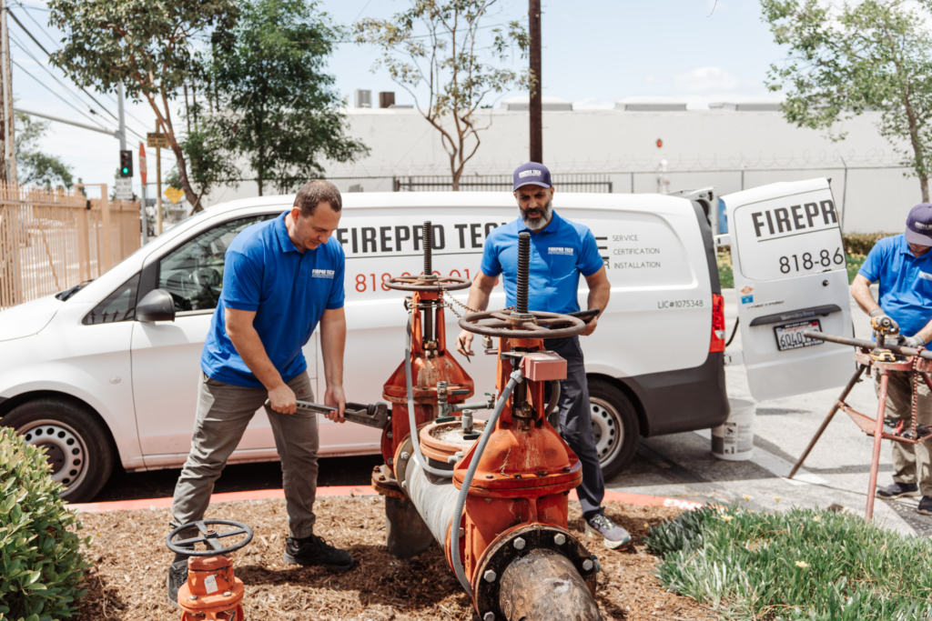 pendant fire sprinkler heads pros working on-site